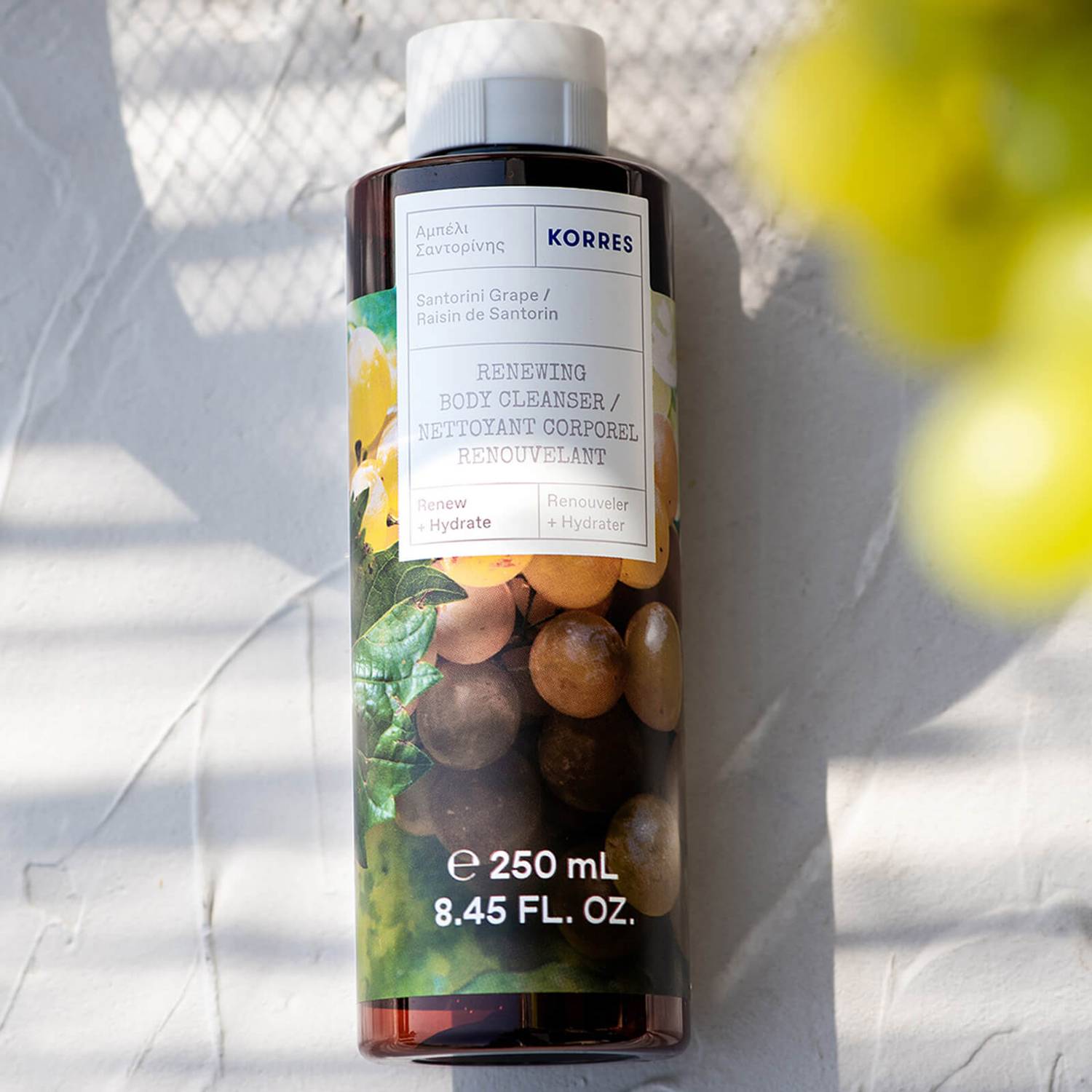 Korres Santorini Grape Renewing Body Cleanser with aloe extract, wheat proteins, and althea extract to help sustain skin's natural moisture levels, delivering a comforting cleanse. 